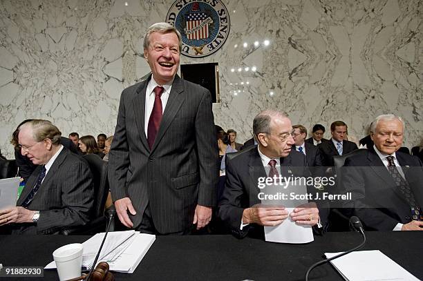 Sen. John D. Rockefeller IV, D-W.Va., Chairman Max Baucus, D-Mont., ranking member Charles E. Grassley, R-Iowa, and Sen. Orrin G. Hatch, R-Utah,...