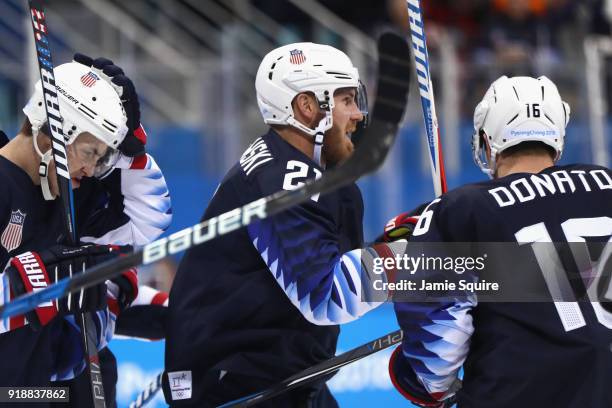 Troy Terry of the United States, James Wisniewski of the United States and Ryan Donato of the United States celebrate after Donato scores in the...