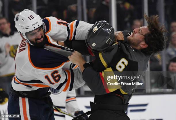 Colin Miller of the Vegas Golden Knights loses his helmet as he fights Jujhar Khaira of the Edmonton Oilers in the third period of their game at...