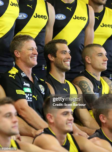 Damien Hardwick, coach of the Tigers, Alex Rance of the Tigers and Dustin Martin of the Tigers look on during a Richmond Tigers AFL team photo...