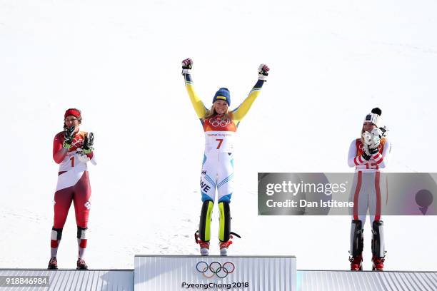 Gold medallist Frida Hansdotter of Sweden celebrates with silver medallist Wendy Holdener of Switzerland and bronze medallist Katharina Gallhuber of...