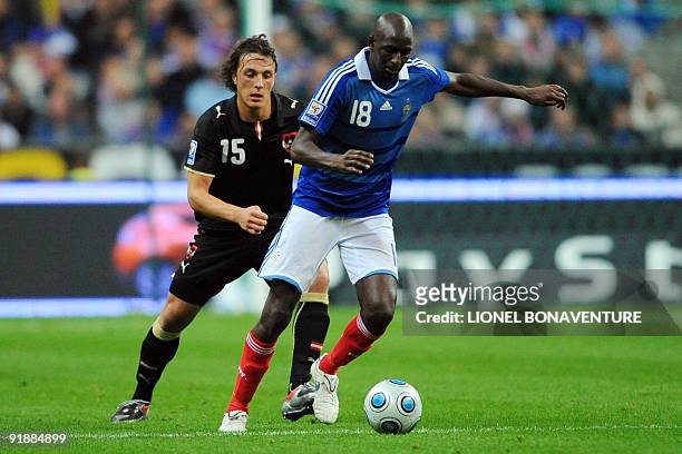 French player Alou Diarra vies with Austrian player Julian Baumgartlinger during the World Cup 2010 qualifying football match France vs. Austria on...