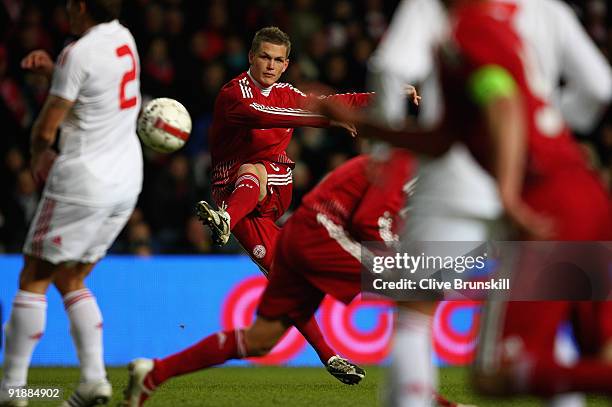 Michael Jacobsen of Denmark shoots at goal during the FIFA 2010 group one World Cup Qualifying match between Denmark and Hungary at the Parken...