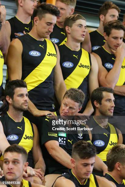 Damien Hardwick, coach of the Tigers recieves a massage from Ivan Soldo during a Richmond Tigers AFL team photo session at Punt Road Oval on February...