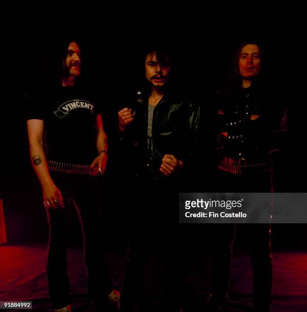 Posed group portrait of Motorhead. Left to right are Lemmy , Phil Taylor and Eddie Clarke in December 1980.