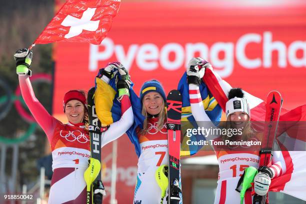 Gold medallist Frida Hansdotter of Sweden celebrates with silver medallist Wendy Holdener of Switzerland and bronze medallist Katharina Gallhuber of...