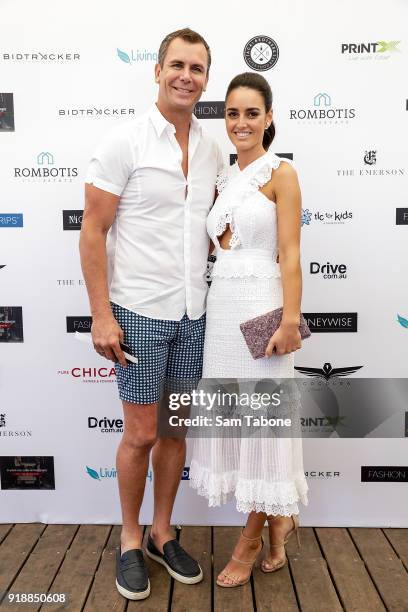 Wayne Carey and Jessica Paulke arrive at the Fashion Aid Twilight Beach Polo on February 16, 2018 in Melbourne, Australia.
