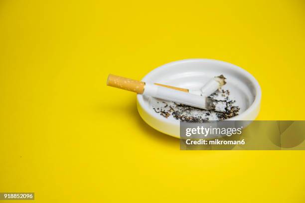 cigarettes and butts in ashtray - cigarette filter stock pictures, royalty-free photos & images