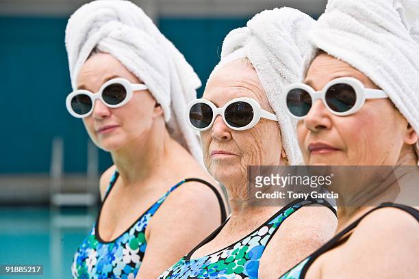 poolside ladies - senior women pool stock pictures, royalty-free photos & images