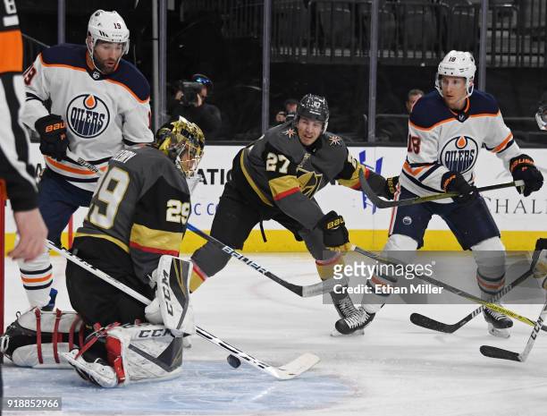 Marc-Andre Fleury of the Vegas Golden Knights blocks a shot by Ryan Strome of the Edmonton Oilers as Shea Theodore of the Golden Knights defends in...
