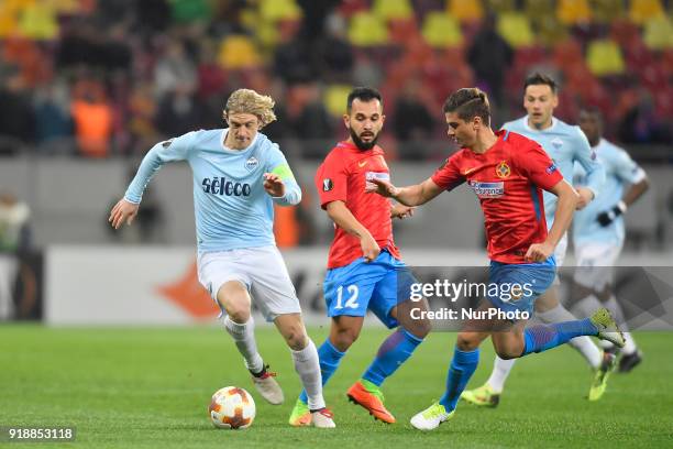 Lazio's Dusan Basta vs Steaua's Dragos Nedelcu during UEFA Europa League Round of 32 match between Steaua Bucharest and Lazio at the National Arena...