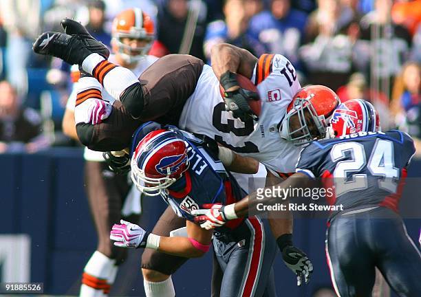 Jamal Lewis of the Cleveland Browns tries to jump over Keith Ellison of the Buffalo Bills during their NFL game at Ralph Wilson Stadium on October...