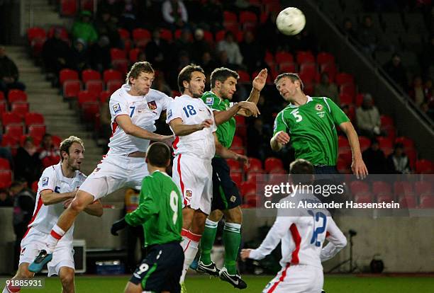 Tomas Necid of Czech Republic and his team mate Tomas Sivak battle for the ball with Garet McAuley of Northern Ireland as well as team mate Stephen...