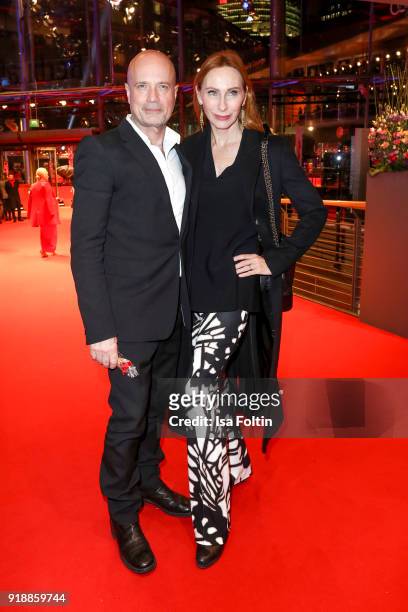 German actor Christian Berkel and his wife German actress Andrea Sawatzki attend the opening party of the 68th Berlinale International Film Festival...