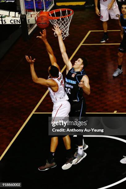 Demitrius Conger of the Hawks goes up against Tom Abercrombie of the Breakers during the round 19 NBL match between the New Zealand Breakers and the...