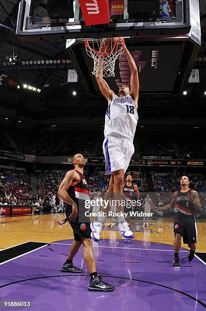 Omri Casspi of the Sacramento Kings dunks against Ime Udoka of the Portland Trail Blazers during the preseason game at Arco Arena on October 7, 2009...