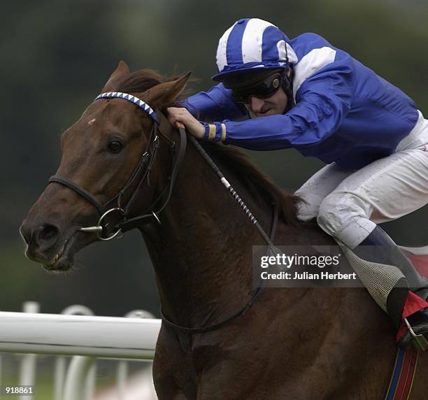 July 05: Richard Hills and Izdiham come up the hill to land The Pentax 'Perfect Image' Stakes run at Sandown Racecourse in Esher on July 05, 2002.