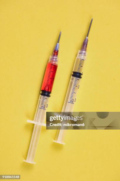 medical syringes with needle. medical concept - steroids stock-fotos und bilder