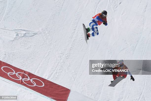 Italy's Michela Moioli and France's Julia Pereira De Sousa Mabileau compete the women's snowboard cross quarter-final at the Phoenix Park during the...