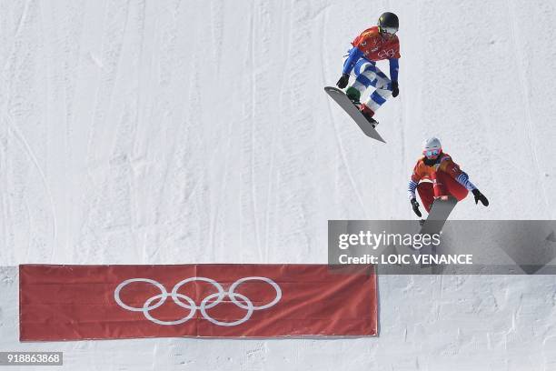 Italy's Michela Moioli and France's Julia Pereira De Sousa Mabileau compete the women's snowboard cross quarter-final at the Phoenix Park during the...