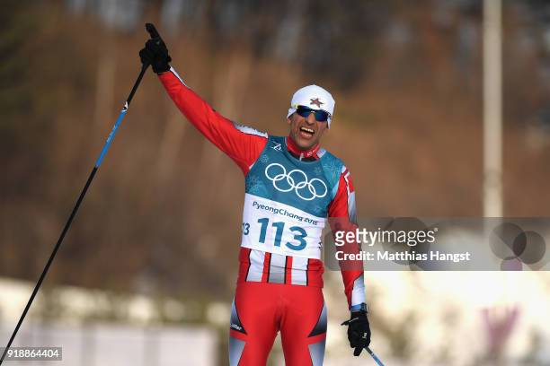 Samir Azzimani of Morocco reacts as he crosses the finish line during the Cross-Country Skiing Men's 15km Free at Alpensia Cross-Country Centre on...