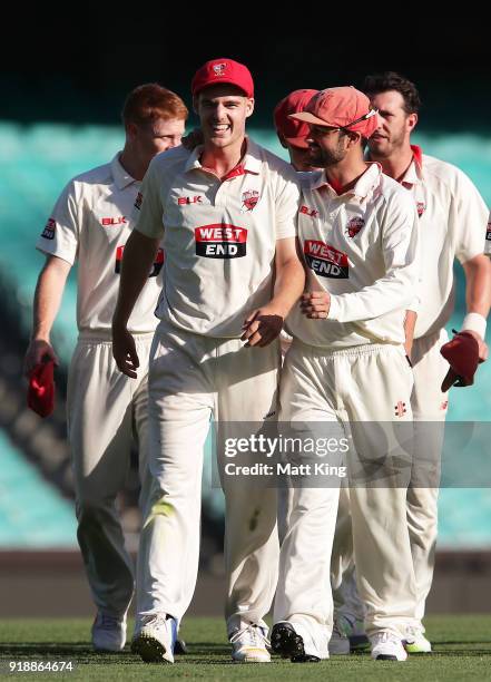 Nick Winter of the Redbacks celebrates with team mates after taking five wickets during day one of the Sheffield Shield match between New South Wales...