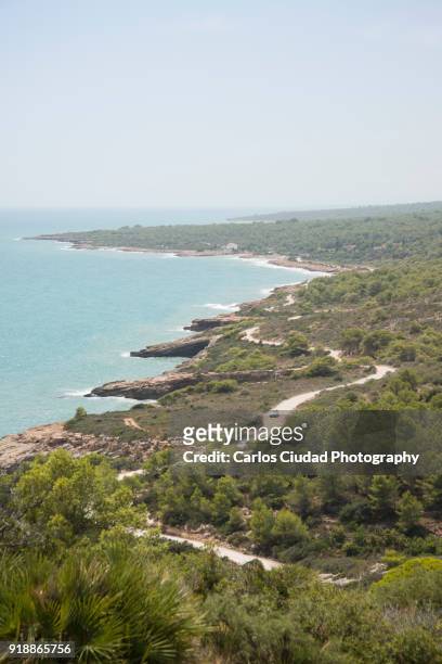 dirt road from peniscola to alcossebre overlooking mediterranean sea, castellon, spain - costa_del_azahar stock pictures, royalty-free photos & images