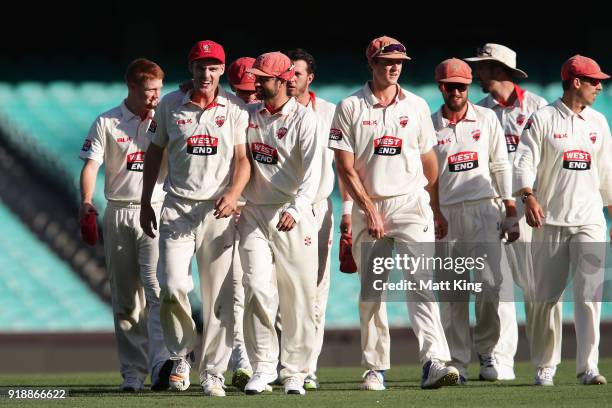 Nick Winter of the Redbacks celebrates with team mates after taking five wickets during day one of the Sheffield Shield match between New South Wales...