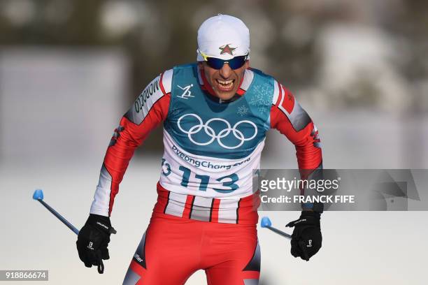 Morocco's Samir Azzimani crosses the finish line in men's 15km cross country freestyle at the Alpensia cross country ski centre during the...