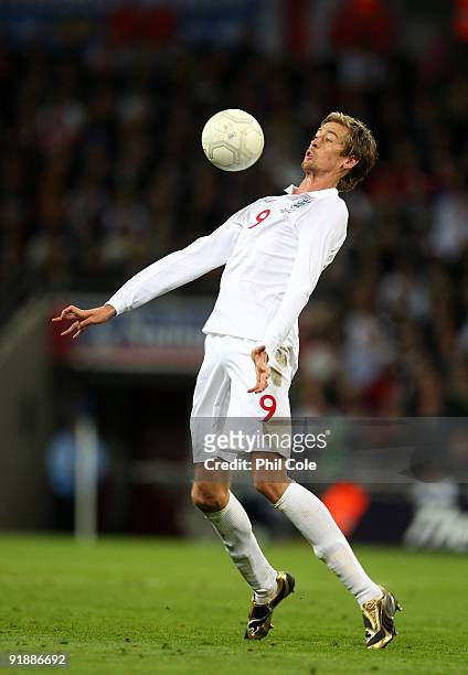 Peter Crouch of England controls the ball during the FIFA 2010 World Cup Qualifying Group 6 match between England and Belarus at Wembley Stadium on...