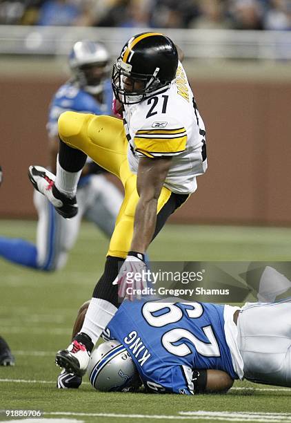 Mewelde Moore of the Pittsburgh Steelers leaps over Eric King of the Detroit Lions during their NFL game on October 11, 2009 at Ford Field in...