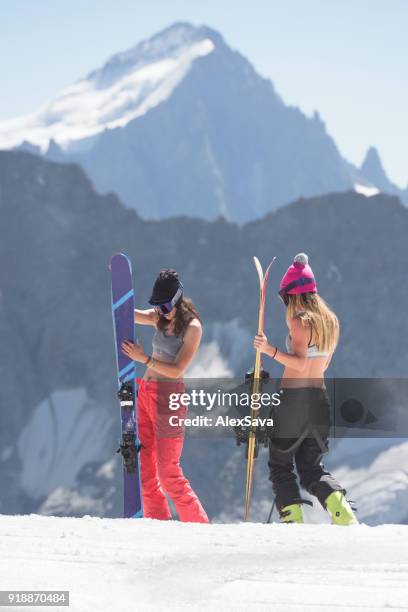 female skiers having fun on a sunny day in mountains - alps romania stock pictures, royalty-free photos & images