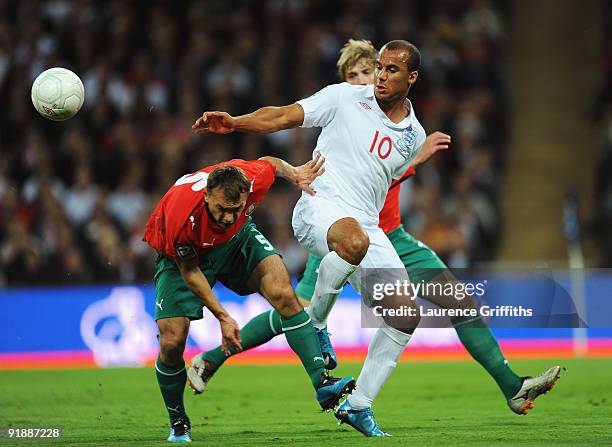 Gabriel Agbonlahor of England battles with Alexander Yurevich of Belarus during the FIFA 2010 World Cup Qualifying Group 6 match between England and...
