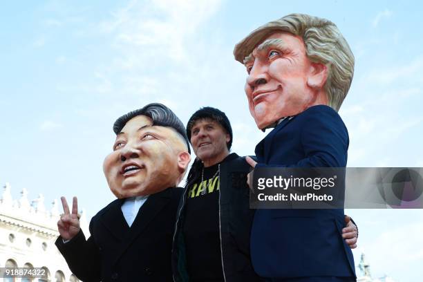 Renzo Rosso poses with a Donald Trump and a Kim Jong Un puppets at the event of the Eagle Flight on February 11, 2018 in Venice, Italy. The theme for...
