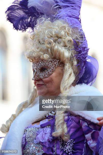 People wearing carnival costumes attend the event of the Eagle Flight on February 11, 2018 in Venice, Italy. The theme for the 2018 edition of Venice...