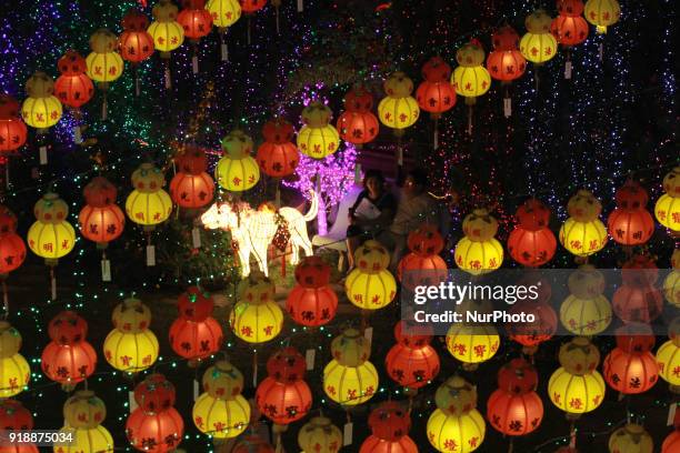 A couple enjoying lantern and light decoration at Kek Lok Si temple Penang on February 15 in Balik Pulau, Malaysia. The Chinese Lunar New Year will...