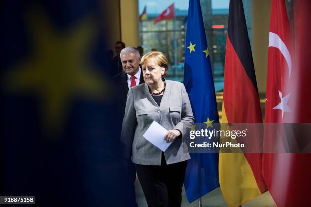 German Chancellor Angela Merkel and Turkish Prime Minister Binali Yildirim arrive to a press conference at the Chancellery in Berlin, Germany on...