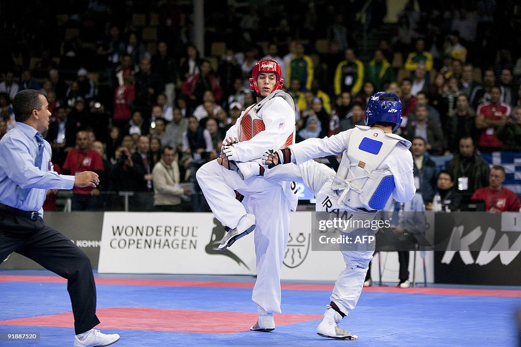 Steven Lopez (L) of the USA fight with F