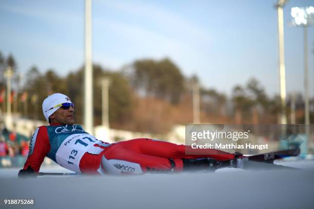Samir Azzimani of Morocco reacts after crossing the finish line during the Cross-Country Skiing Men's 15km Free at Alpensia Cross-Country Centre on...