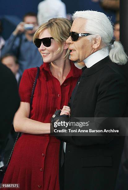 Actress Kirsten Dunst and Designer Karl Lagerfeld greet at Chanel Fashion Show on October 5th, 2007 in Paris.