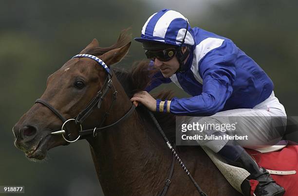 July 05: Richard Hills and Izdiham come up the hill to land The Pentax 'Perfect Image' Stakes run at Sandown Racecourse in Esher on July 05, 2002.