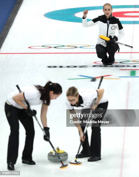 Victoria Moiseeva of Olympic Athlete from Russia directs Julia Guzieva and Galina Arsenkina in their game against Sweden during the Curling Women's...
