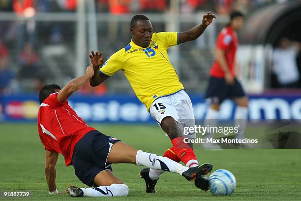 Chile's Alexis Sanchez vies for the ball with Walter Ayovi of Ecuador during their 2010 FIFA World Cup Qualifier match at the Nacional Stadium on...