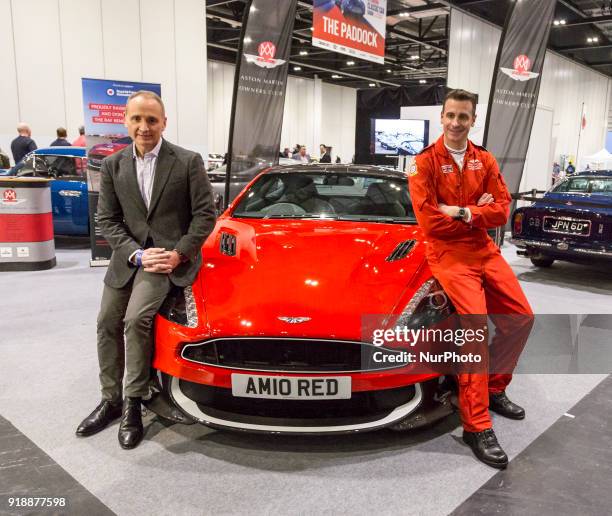 Red Arrows Squadron Leader Adam Collins and a man who won the car in a lottery with Aston Martin 10 at the ExCel Exhibition Centre in London during...