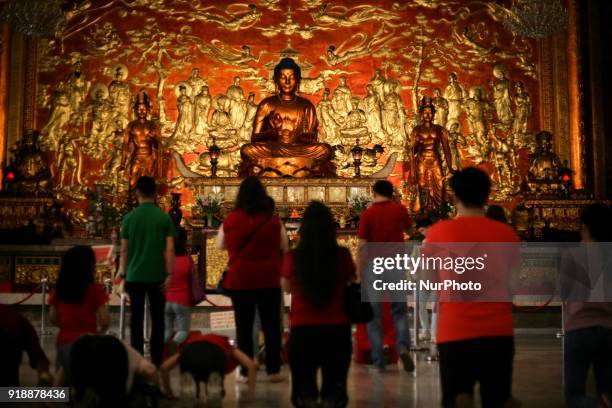 Chinese-Filipinos venerate the Medicine Buddha at the buddhist Seng Guan Temple in Manila, Philippines during Chinese New Year celebrations on...