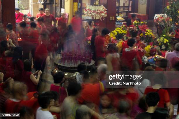 In this picture taken with a slow shutter speed, Chinese-Filipinos pray at the buddhist Seng Guan Temple in Manila, Philippines during Chinese New...