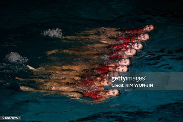 In a photo taken on on February 15 synchronised swimmers perform during festivities marking the 'Day of the Shining Star', the birthday of late North...