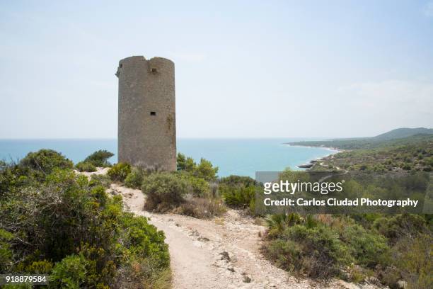 badum tower in the natural park of sierra de irta, peniscola, castellon, spain - costa_del_azahar stock pictures, royalty-free photos & images