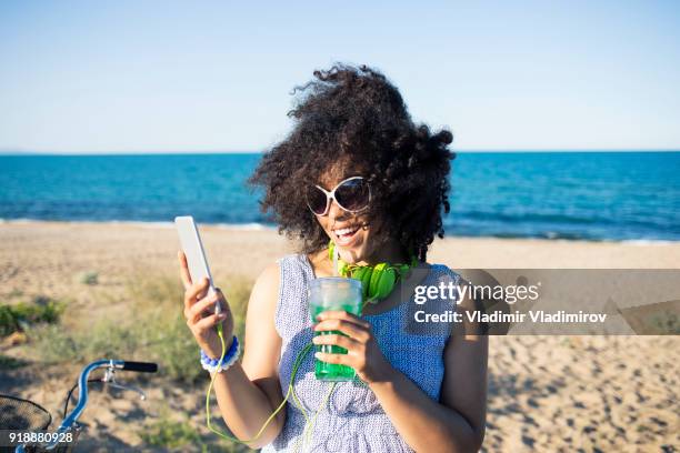 woman with bike having fun on beach - we can do it stock pictures, royalty-free photos & images