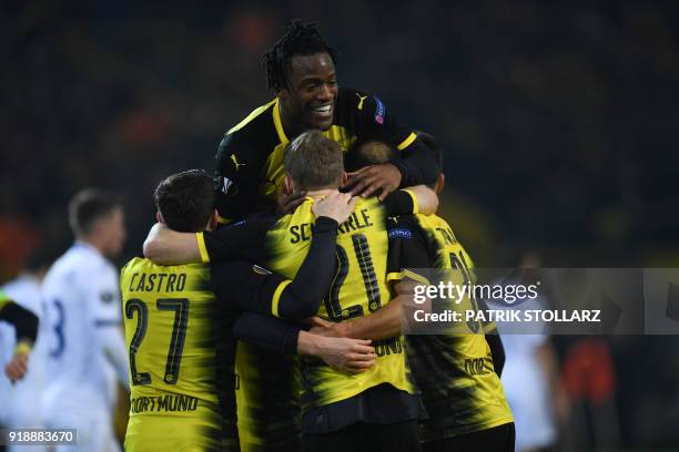 Dortmund's Belgian striker Michy Batshuayi celebrates with teammates Dortmund's German midfielder Gonzalo Castro, Dortmund's German midfielder Andre...